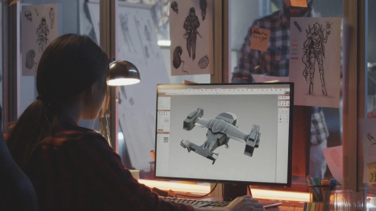 video game developer working on computer, designing animation