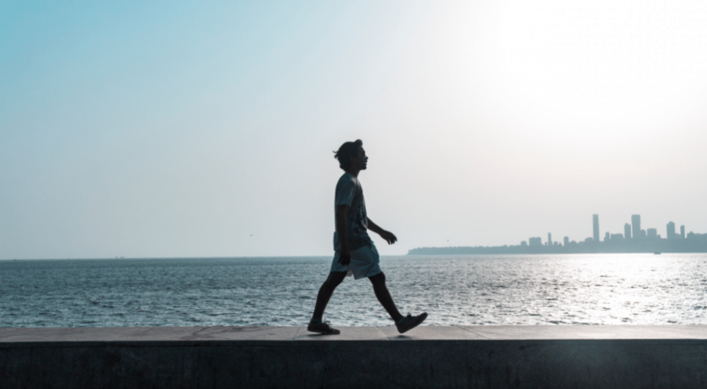 man walking on the seaside